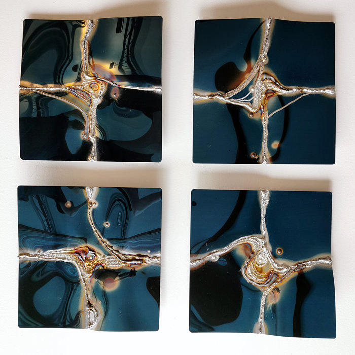 2x2 wall artwork in blue, polished stainless steel