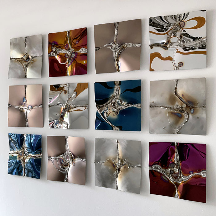 Small squares create a wall-filling work of art in stainless steel