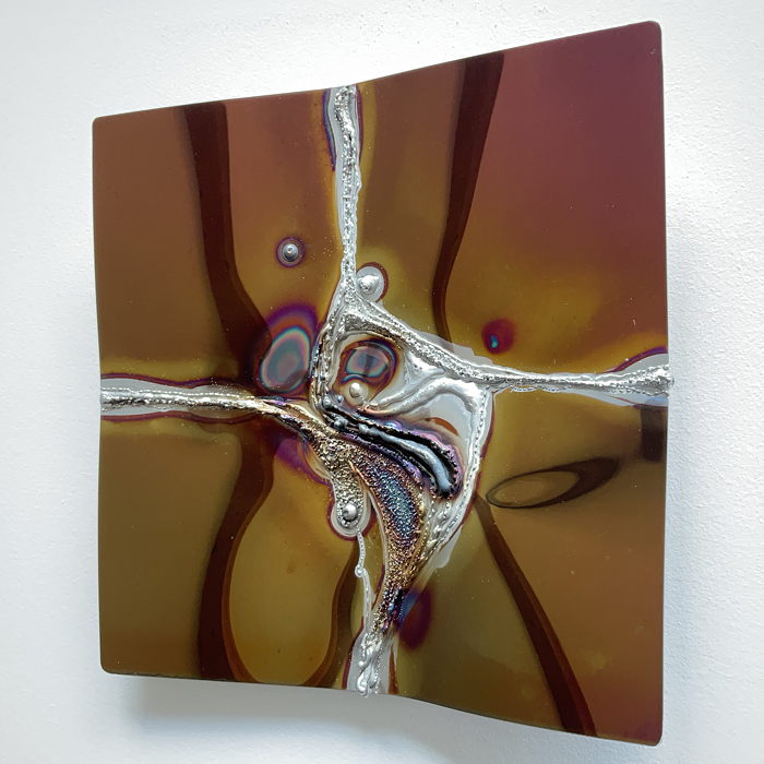 Wall artwork in red, polished stainless steel