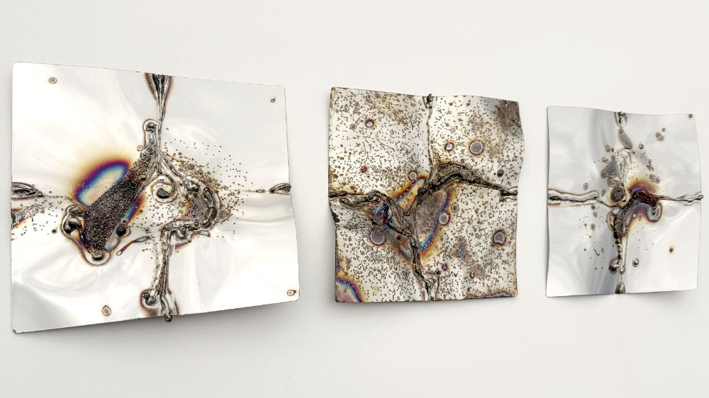 Mirror-polished metal wall art by the artist